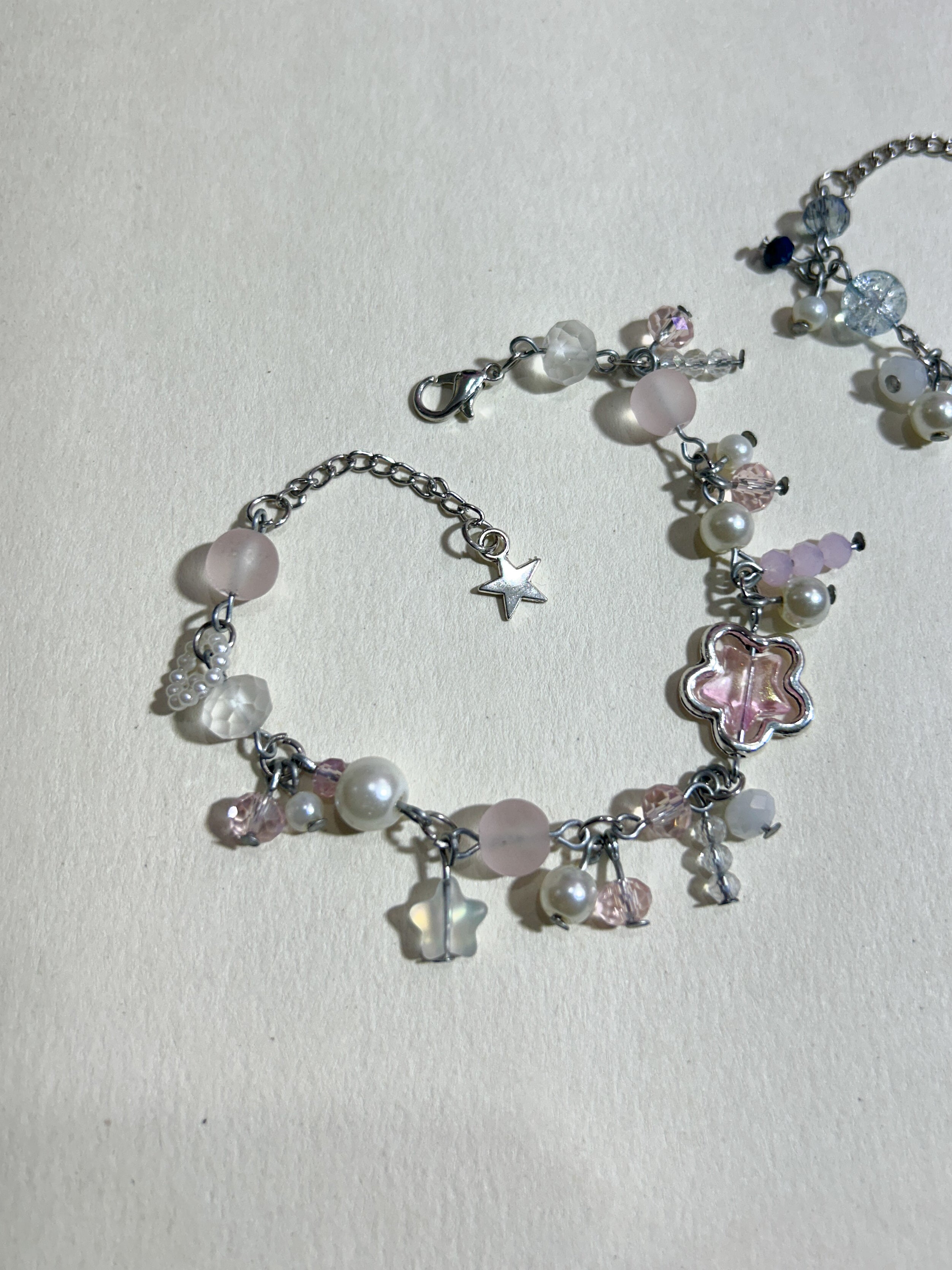 ICY BLUE & PASTEL PINK CLUTTERED CHARMS BRACELET