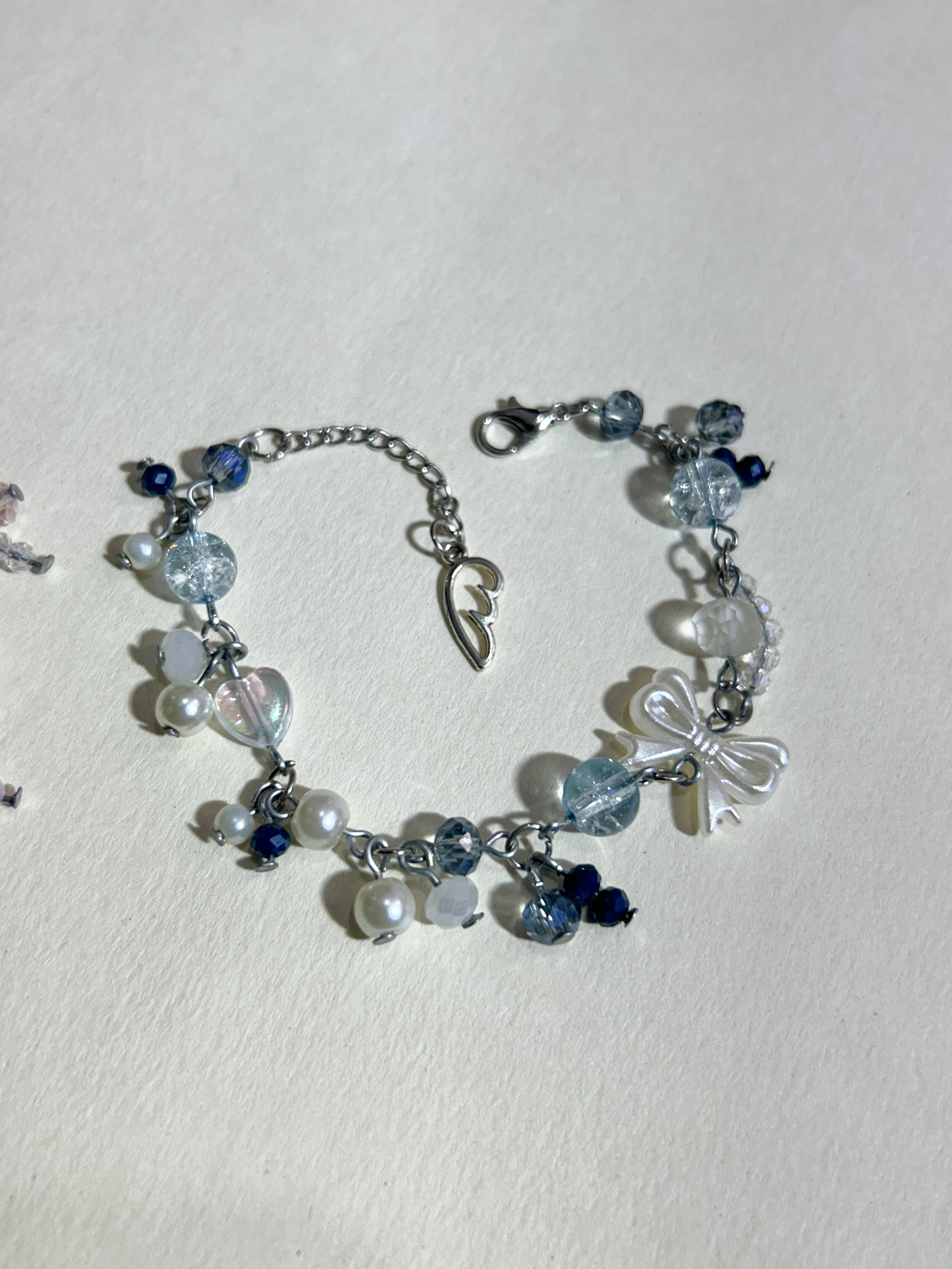 ICY BLUE & PASTEL PINK CLUTTERED CHARMS BRACELET